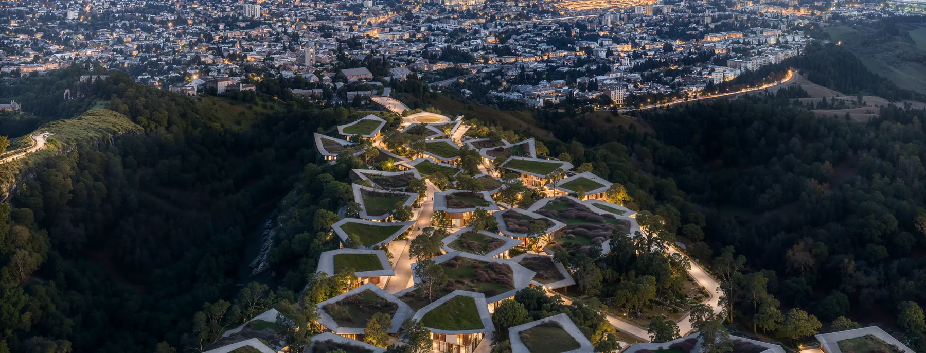 Aerial view of Mira Verde with Tbilisi beyond at night