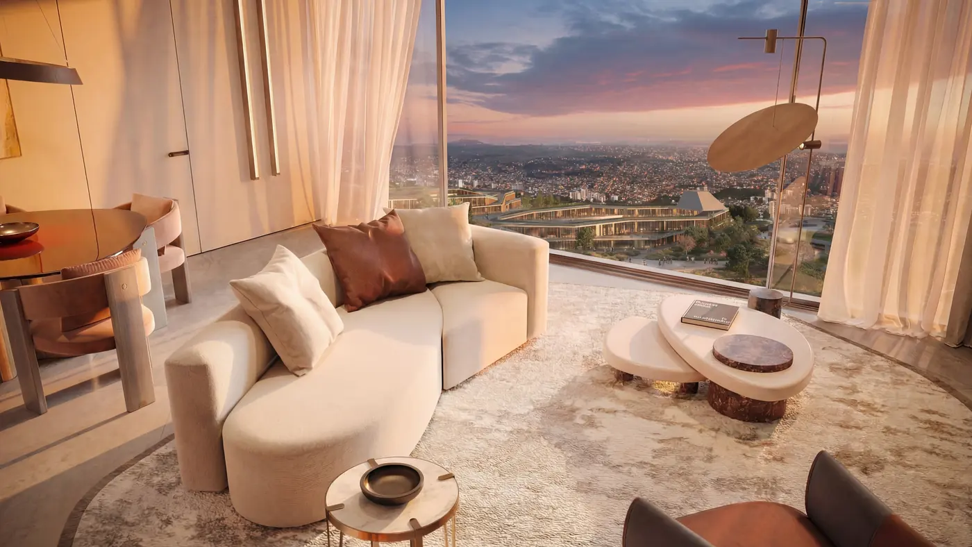 Living area with panoramic city view at dusk